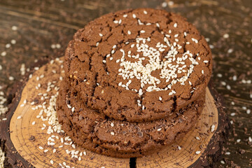 round chocolate biscuits with white sesame seeds and cocoa powder