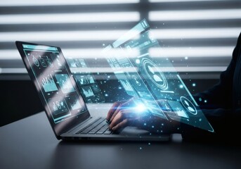 Hands on laptop with glowing digital interfaces and data visualizations