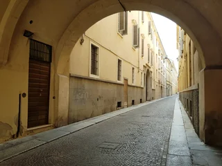 Fotobehang Smalle Straten View of a narrow street in the old city of Rome, Italy  © kos1976