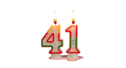 Burning birthday candles shaped as number forty one against a black background in close up view