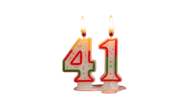 Burning birthday candles shaped as number forty one against a black background in close up view