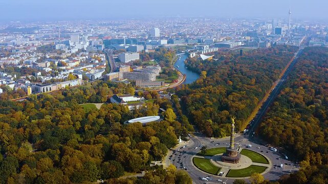 4K drone panorama over Berlin&rsquo;s Tiergarten : Victory Column at Grober Stern, the Spree, Berlin Hauptbahnhof and the government quarter glowing in crisp autumn light.