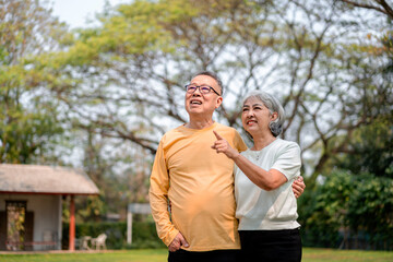 Happy Asian Older Couple Enjoying Time Outdoors Together in Park Garden Care Senior Retirement Lifestyle Walking Nature