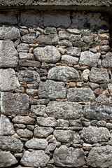 Texture. Hewn stone wall. Background. Man made. Horizontal shot.	