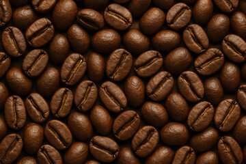 Fototapeta premium A close-up view of roasted coffee beans, showcasing their rich brown color and texture, perfect for coffee lovers and enthusiasts.