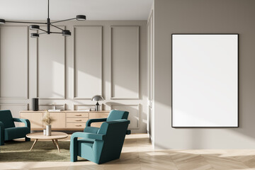 Modern interior room with blank framed poster mockup on wall, teal armchairs, wood furniture, natural lighting, and clean minimalist layout. 3D Rendering