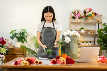 Young Adult Woman Florist Arranging Fresh Flowers in Flower Shop For Bouquet Decoration Floral Arrangement Design And Online Business Marketing