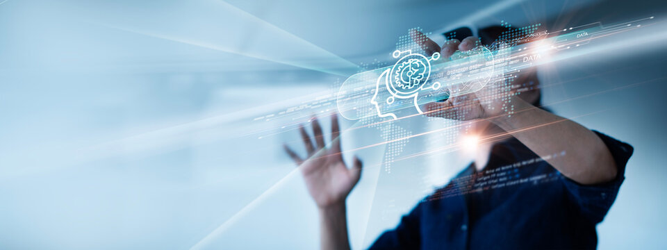 Businessman using hologram smart VR headset interactive with AI artificial intelligence brain processor on data network, Machine learning, AI chatbot, big data and to use generative AI for business
