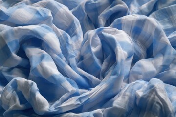 Obraz premium Crumpled blue checkered paper texture displaying a realistic pattern in soft lighting with notable folds and layers