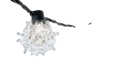 Decorative crystal string light bulb closeup on the transparent background for festive indoor and outdoor lighting