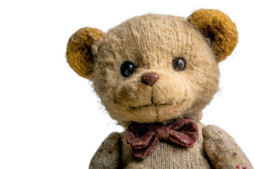 Teddy bear stands alone on a pure white background displaying a charming vintage style and handcrafted features that evoke feelings of nostalgia and warmth