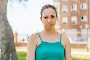 Fototapeta premium Young pretty woman at outdoors . Portrait