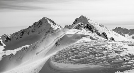 Snowy Mountain Peaks Covered in Snow with Wind-swept Snowdrifts in Black and White