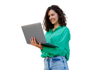 Young woman with curly hair and green shirt smiling and holding a laptop, isolated on transparent background