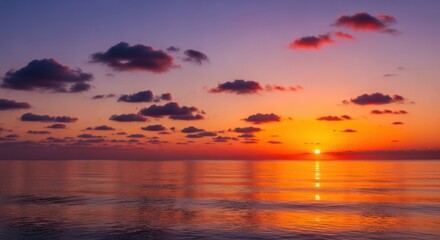 Obraz premium Vibrant Sunset Over Calm Ocean with Colorful Clouds and Warm Light