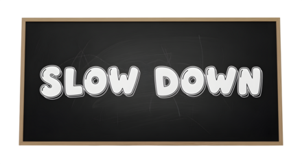Chalkboard sign with “slow down” in bubble letters, isolated on white background