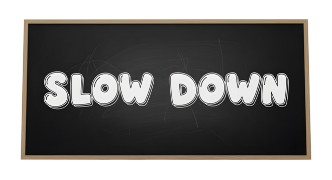 Chalkboard sign with “slow down” in bubble letters, isolated on white background