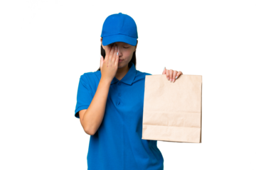 Young Asian woman taking a bag of takeaway food over isolated background with tired and sick expression