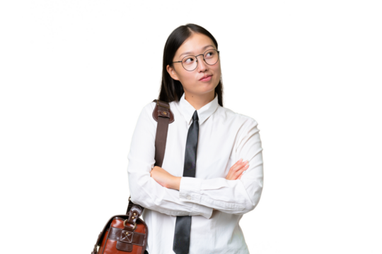 Young Asian business woman over isolated background looking up while smiling