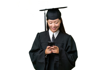Young university graduate Asian woman over isolated background sending a message with the mobile