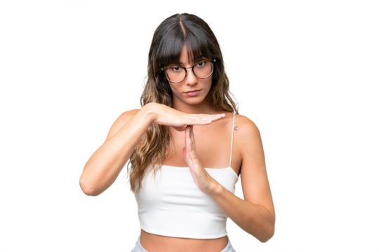 Young caucasian woman over isolated background making time out gesture