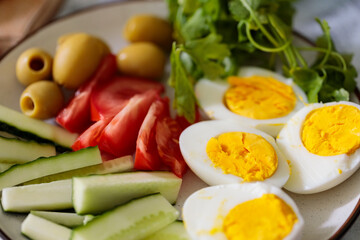 Boiled Egg with Fresh Vegetables and Herbs on Plate