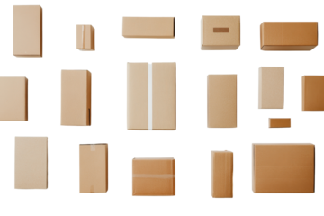 Collection of cardboard boxes arranged for shipping insulation materials in a warehouse setting during daylight hours