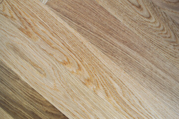 Naklejka premium Oak Herringbone Parquet - Natural Grain and Warm Contrast