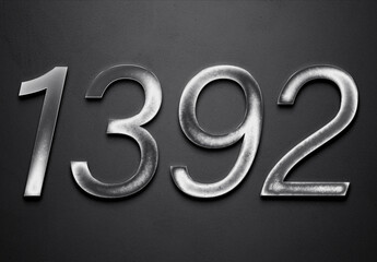 Chrome metal 3D number design of 1392 on grey background.