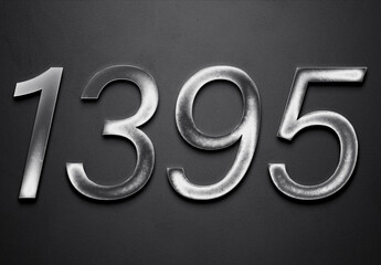 Chrome metal 3D number design of 1395 on grey background.