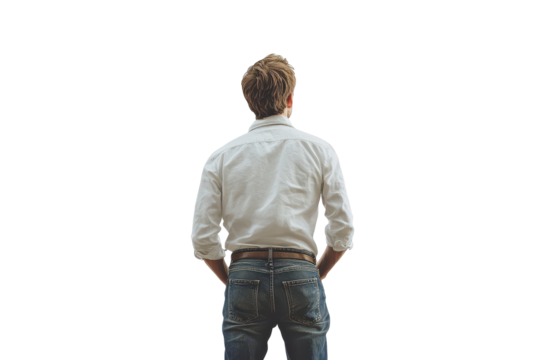 Man in jeans gazing upwards with a thoughtful expression while standing against an isolated background during daylight - Powered by Adobe