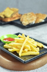 Plates of French fries with ketchup, a mesmerizing of crispy, golden and highlighting each fry's perfect texture and irresistible appeal