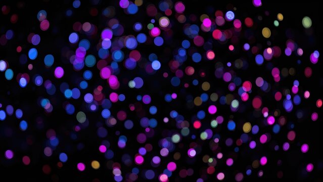 Multicolored bokeh glowing over a dark night scene