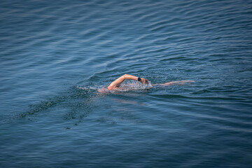 a man swimming in the sea.