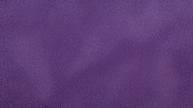 Close-up view of purple suede with raised design, showcasing soft textile surface ideal for upholstery and fashion