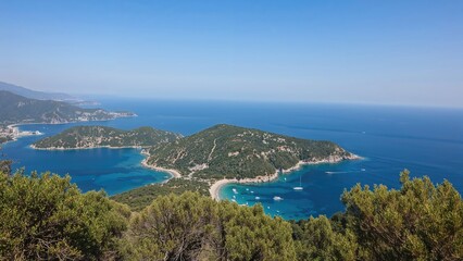 Untamed landscapes by the coast featuring islands, bays, and hiking trails in the Aegean Sea region.
