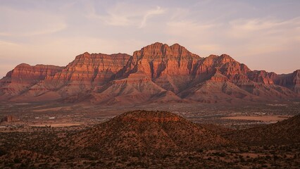Image showcasing a striking red hill surrounded by trees