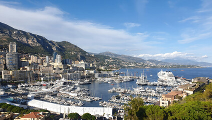 Naklejka premium Monaco city skyline and Port Hercules marina under blue sky