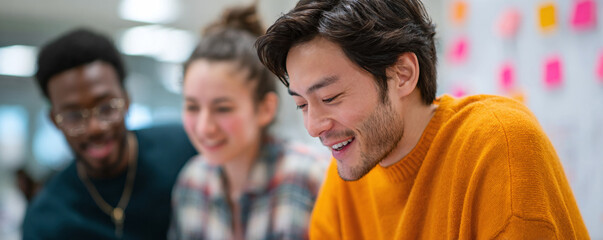Fototapeta premium Diverse team collaborating on project, smiles and positive energy. Perfect for illustrating teamwork, innovation, success, and shared vision.