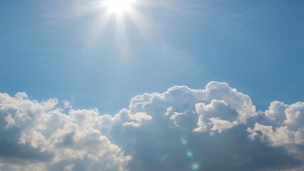 Pastel blue sky with blurred sun rays at dawn