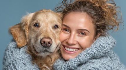 Woman and dog embracing warmly.