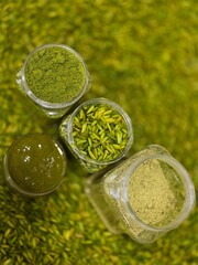 Different Forms of Pistachio in Glass Jars - Powder, Slivers, Paste