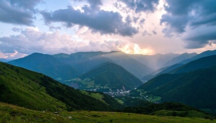 Fototapeta premium Countryside landscape with rolling hills, sunlit meadows, and dramatic light streaming through partly cloudy skies.
