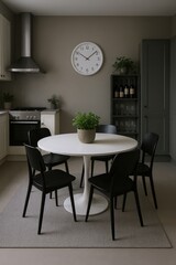 Modern Kitchen Dining Area with White Tulip Table, Black Chairs, and Stainless Steel Range Hood