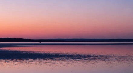 Serene Sunset Over Calm Lake with Pink and Purple Sky Reflections