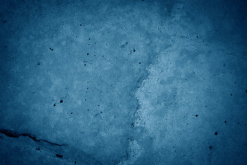 dark blue grunge cement wall background.