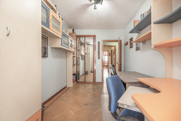 Bright bedroom with white floating wardrobe and open shelves for an airy, uncluttered look
