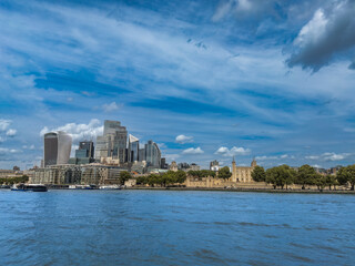 Fototapeta premium View over the Thames river towards the Tower of London and the City of London in London, England, in summer.