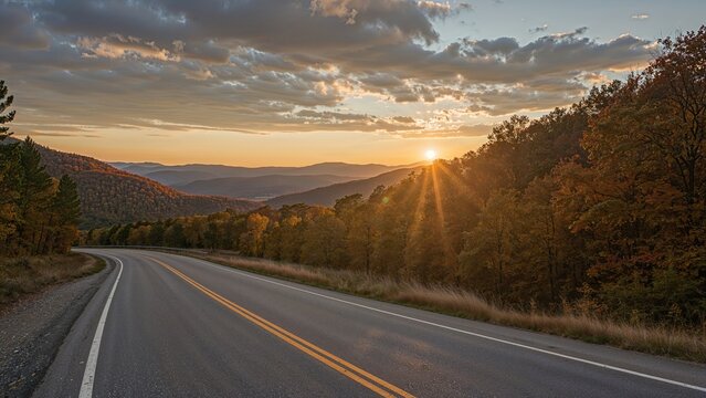 Scenic highway winding through colorful fall foliage at dawn in a mountainous region - Powered by Adobe