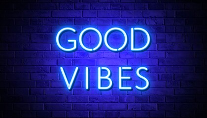 Neon sign reading "good vibes" on a brick wall.